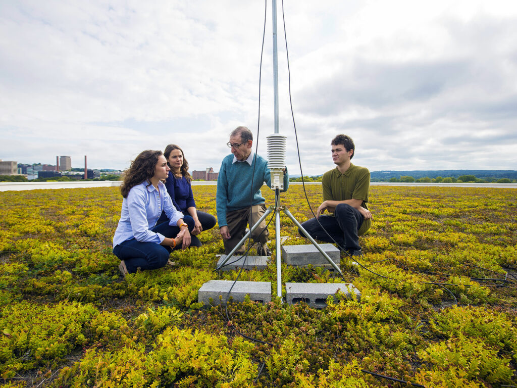 Professor Cliff Davidson with three students on green roof